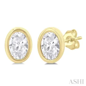 1/5 Ctw Petite Bezel Set Oval Cut Diamond Fashion Stud Earring in 10K Yellow Gold